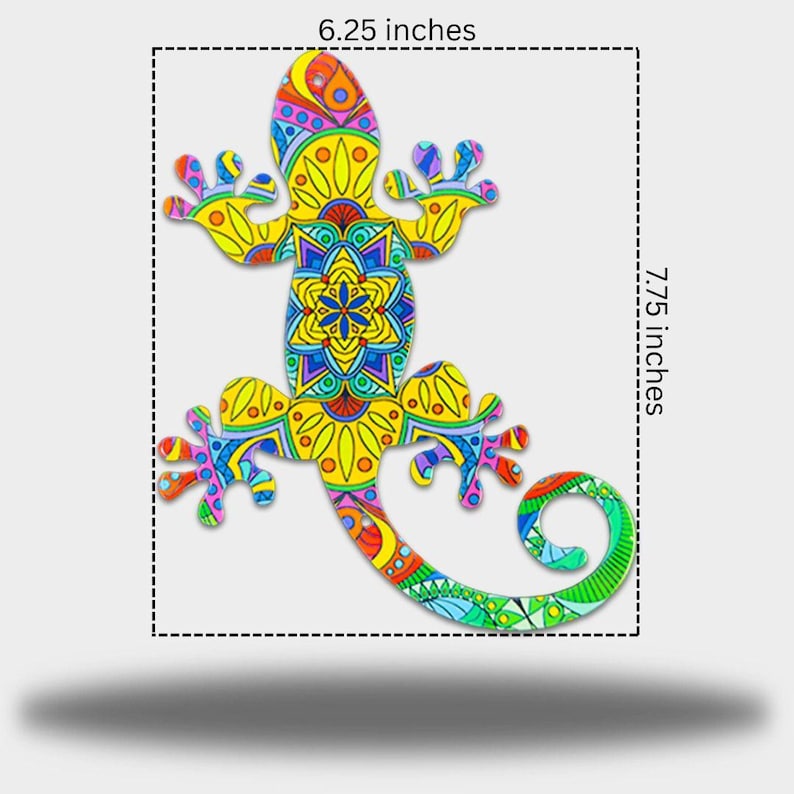 May include: A decorative lizard with a detailed, patterned design. The lizard is approximately 16 cm wide and 19.7 cm long. The design features yellow, blue, green, and red colors. The lizard's tail is curled.