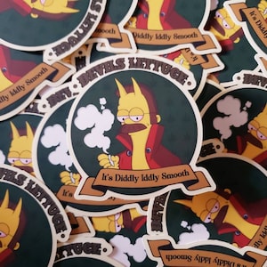 May include: A stack of round stickers featuring a cartoon character with yellow skin, red clothing, and a mustache. The character is smoking a cigarette and the text "It's Diddly Iddly Smooth" is on the sticker. The stickers are green with brown lettering and a yellow border.