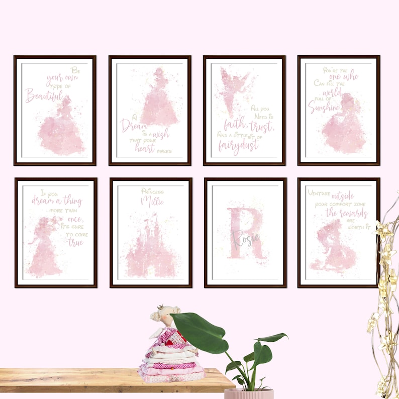 May include: A set of eight pink watercolor prints with inspirational quotes and a princess theme. The prints feature a castle, a fairy, a princess, and a letter R. The quotes include "Be your own type of beautiful", "Dream is a wish that your heart makes", "As you need to faith, trust, and a sprinkle of fairy dust", "You're the one who can free the world of sunshine", "If you dream a thing more than once, it's sure to come true", "Princess Millie", "Rosie", and "Venture outside your comfort zone, the rewards are worth it".