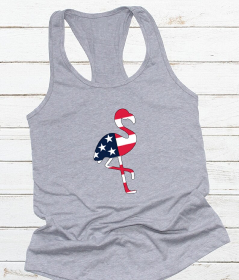 May include: Gray tank top with a flamingo silhouette design. The flamingo is filled with the colors of the American flag.