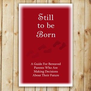 May include: A red card with white text that reads "Still to be Born" and a guide for bereaved parents who are making decisions about their future. The card has several small footprints in white.