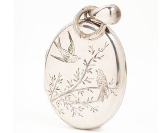 Victorian Aesthetic Movement Silver Locket With A Pair Of Swallows