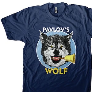 May include: A navy blue t-shirt with a graphic of a wolf wearing a bell. The text "Pavlov's Wolf" is printed in yellow below the wolf.