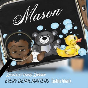 May include: Black diaper bag with the name "Mason" in white script. The bag features a cartoon illustration of a baby, a gray teddy bear, and a yellow rubber duck. The text "DIGITALLY HAND-DRAWN EVERY DETAIL MATTERS Custom Artwork" is also visible.