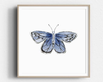 May include: A framed watercolor painting of a blue butterfly with black outlines and white spots on its wings.