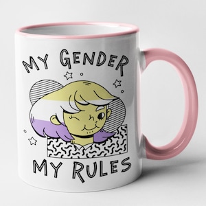 May include: White ceramic mug with a pink rim and handle. The mug features a cartoon illustration of a person with a genderqueer flag colour scheme and the text "My Gender My Rules".