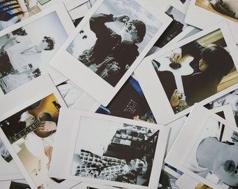 May include: A collection of instant photos, some in black and white, some in color, featuring a variety of subjects, including a person playing a guitar, a person wearing a plaid shirt, and a person wearing a jacket.