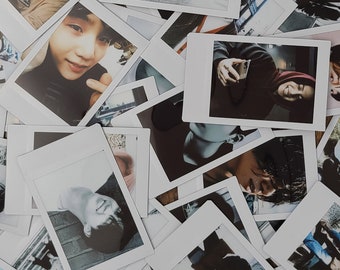 May include: A collection of Polaroid photos, each featuring a different person. The photos are arranged in a random pattern, creating a visually interesting collage.