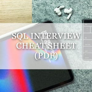 May include: A tablet displaying the text "SQL INTERVIEW CHEATSHEET (PDF)". A white stylus is on the tablet. White wireless earbuds and a laptop keyboard are also visible.