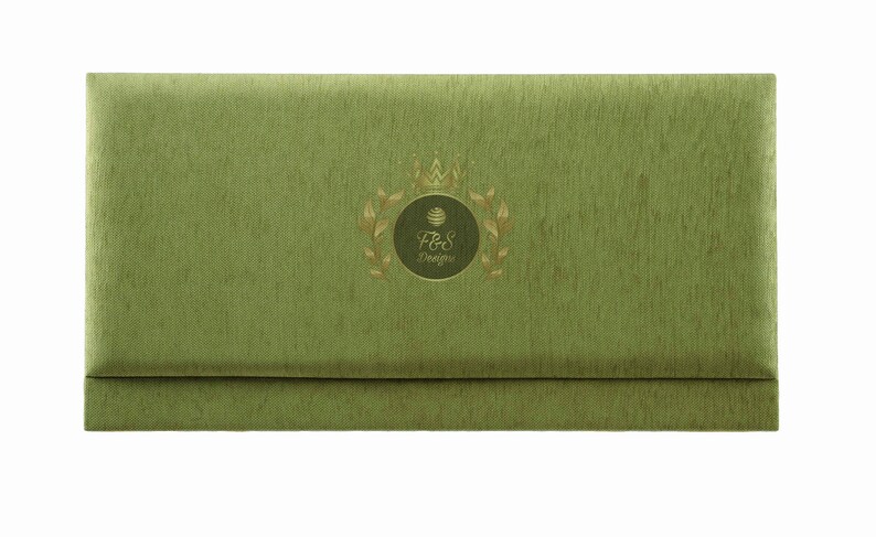 May include: A green fabric envelope with a gold crown and the text "F&S Designs" in a circle.