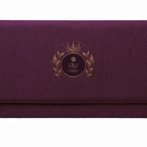 May include: A deep purple envelope with a gold embossed logo featuring a crown, leaves, and the text "F&S Designs".