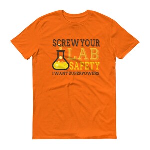 May include: Orange t-shirt with a black graphic of a beaker and the text "Screw your lab safety I want superpowers".