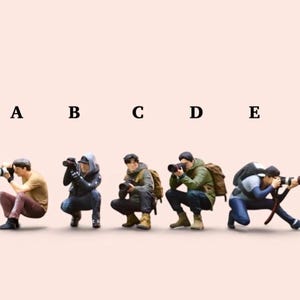May include: Five miniature figurines of photographers in various casual outfits, each crouching and holding a camera to their eye. The figures are labeled A, B, C, D, and E in black text above them, set against a solid light pink background.