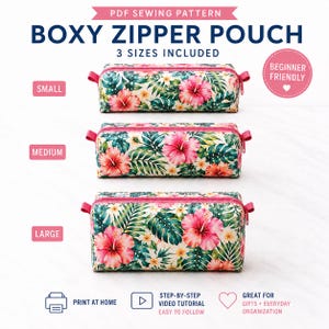 May include: A PDF sewing pattern for a boxy zipper pouch in three sizes. The pouches feature a tropical print with pink hibiscus flowers and green palm leaves on a white background, with pink zippers and side tabs. Text includes "Boxy Zipper Pouch".