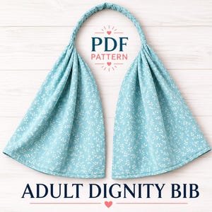 May include: An adult dignity bib featuring a light blue fabric with a white vine and leaf pattern. The bib has a gathered neck strap and is presented as a PDF pattern. The text ADULT DIGNITY BIB is printed at the bottom of the image.