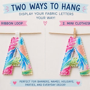 May include: A fabric letter A featuring a colorful botanical print with pink, blue, and green leaves. The text reads TWO WAYS TO HANG, DISPLAY YOUR FABRIC LETTERS YOUR WAY, 1. RIBBON LOOP, 2. MINI CLOTHESPIN, and PERFECT FOR BANNERS, NAMES, HOLIDAYS, PARTIES, AND EVERYDAY DECOR.