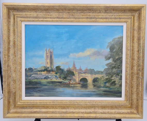 An Original Oil on Board by Ivan Taylor (1946 - ) titled “Magdalen Bridge, Oxford”.  Framed.