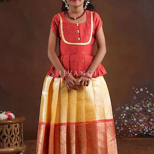 Shivangi Clothing Yellow Paisley Peacock Pattu Pavadai For Girls