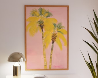 May include: A framed painting of two yellow palm trees against a pink background. The painting is hanging on a white wall above a light-colored cabinet.