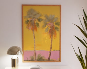 May include: A framed print of two palm trees against a yellow and pink sunset. The print is in a wooden frame and is hanging on a white wall.