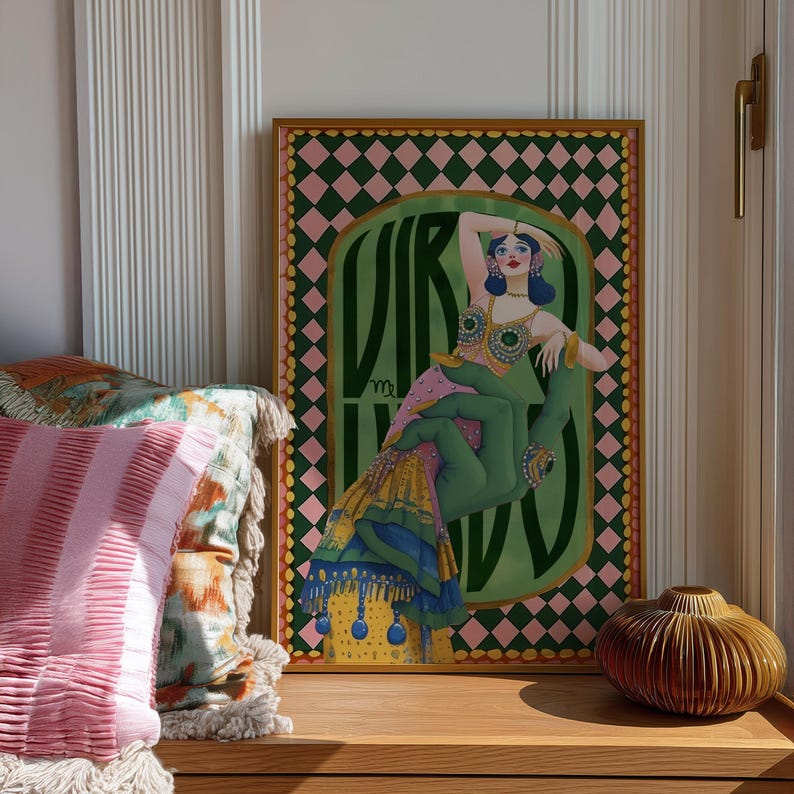 Virgo zodiac wall art featuring a dazzling, vintage-style showgirl held gracefully by a green hand, adorned in vibrant bejeweled fashion. Surrounded by bold “Virgo” lettering and a retro pink-and-green checkerboard frame, this mystical, feminine artwork is perfect for astrology lovers, coquette dorms, and magical bedroom spaces.