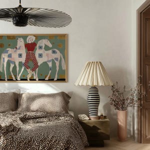 Modern western art print featuring a stylish cowgirl in a white hat and red polka dot outfit posed between two white patchwork horses. Soft sage green background with gold geometric accents and quilt-like horse patterns create a chic, editorial equestrian vibe. Perfect for contemporary western decor, ranch house interiors, cowgirl chic bedrooms, offices, and giftable horse lover wall art.