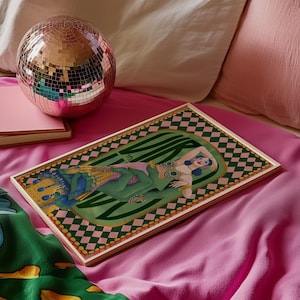 Virgo zodiac wall art featuring a dazzling, vintage-style showgirl held gracefully by a green hand, adorned in vibrant bejeweled fashion. Surrounded by bold “Virgo” lettering and a retro pink-and-green checkerboard frame, this mystical, feminine artwork is perfect for astrology lovers, coquette dorms, and magical bedroom spaces.
