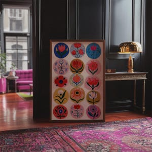 May include: A framed floral art print featuring a collection of colorful flower illustrations in circular designs. The artwork is displayed in a room with a dark wall, a gold lamp, and a patterned rug.