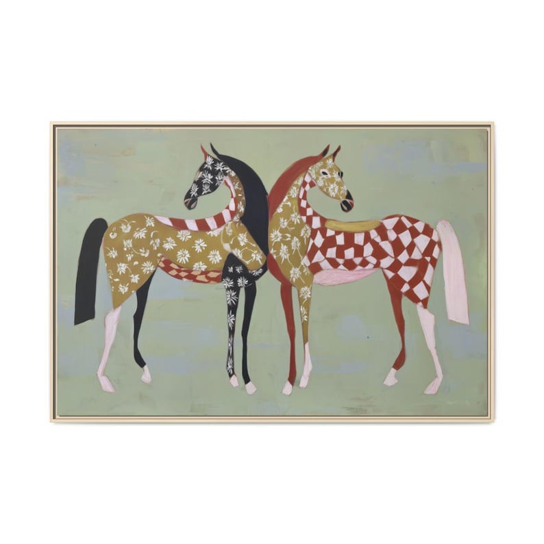 May include: An artistic painting of two horses standing side by side. The horse on the left has a black mane and tail, with a gold and white floral pattern on its body. The horse on the right has a red and white checkered pattern.