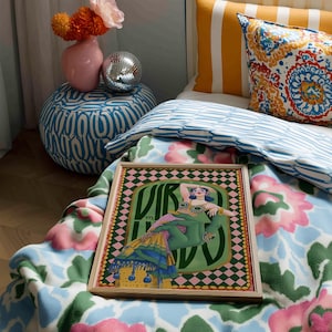 Virgo zodiac wall art featuring a dazzling, vintage-style showgirl held gracefully by a green hand, adorned in vibrant bejeweled fashion. Surrounded by bold “Virgo” lettering and a retro pink-and-green checkerboard frame, this mystical, feminine artwork is perfect for astrology lovers, coquette dorms, and magical bedroom spaces.