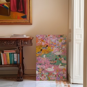 May include: A vibrant painting depicting ducks amidst a floral setting. The artwork showcases ducks with black and white patterns, set against a backdrop of pink, yellow, and green flowers. The painting is displayed in a room with a wooden table and a framed painting.