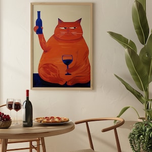 Large orange cat with a blue bottle in one paw and a blue glass in the other, against a beige background.