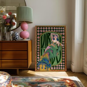 Virgo zodiac wall art featuring a dazzling, vintage-style showgirl held gracefully by a green hand, adorned in vibrant bejeweled fashion. Surrounded by bold “Virgo” lettering and a retro pink-and-green checkerboard frame, this mystical, feminine artwork is perfect for astrology lovers, coquette dorms, and magical bedroom spaces.