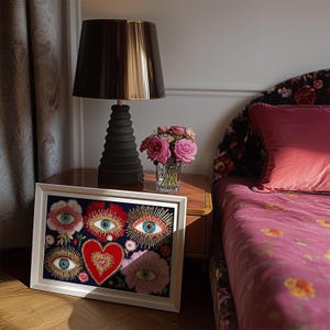 Mystical wall art featuring all-seeing eyes set in radiant flowers with golden rays, anchored by a glowing red heart. This visionary artwork merges mysticism, folk spirituality, and psychedelic symbolism, making it a perfect fit for a witchy boho room, meditation corner, or spiritual gift. Designed for lovers of esoteric beauty and third-eye awakening art.