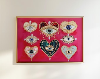 May include: A framed print with a pink background featuring nine stylized hearts with eyes. Each heart is decorated with gold and jeweled accents.