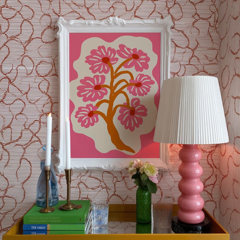 Flat-graphic illustration of a stylized orange tree trunk sprouting bright pink daisies on a cream blob shape against a vibrant pink background—cheerful, preppy and coquette-inspired.