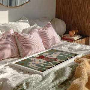 Modern western art print featuring a stylish cowgirl in a white hat and red polka dot outfit posed between two white patchwork horses. Soft sage green background with gold geometric accents and quilt-like horse patterns create a chic, editorial equestrian vibe. Perfect for contemporary western decor, ranch house interiors, cowgirl chic bedrooms, offices, and giftable horse lover wall art.