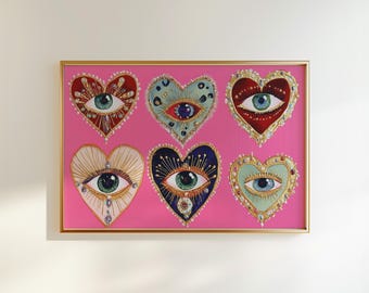 Puede incluir: Obra de arte enmarcada con seis diseños en forma de corazón, cada uno con un motivo de ojo. Los corazones son de varios colores, incluyendo rojo, azul y dorado, sobre un fondo rosa vibrante. La obra está encerrada en un marco dorado.