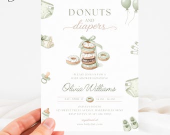 May include: A white baby shower invitation card featuring the text DONUTS AND DIAPERS, a stack of donuts with a green ribbon, balloons, diapers, a pacifier, and baby shoes. The card includes event details for Olivia Williams on April 17.