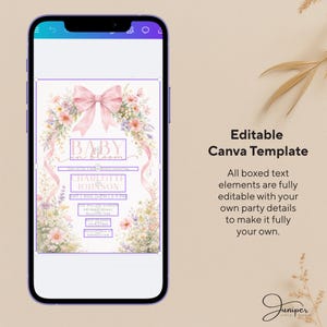 a smartphone screen with a baby-themed canvas template, which includes a pink bow and floral elements. The text on the screen indicates that the template is editable, allowing users to customize the boxed text elements with their own party details.