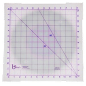 May include: A white cutting mat with a grid pattern and two diagonal lines. The mat is marked with numbers from 1 to 15 on each side.