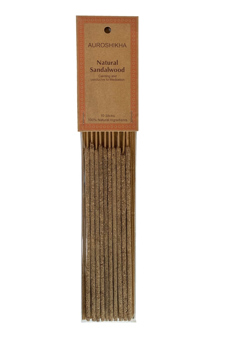 May include: A pack of 10 natural sandalwood incense sticks. The packaging is brown with a white label that reads "AUROSHIKHA Natural Sandalwood Calming and conducive to Meditation 10 Sticks 100% Natural Ingredients."