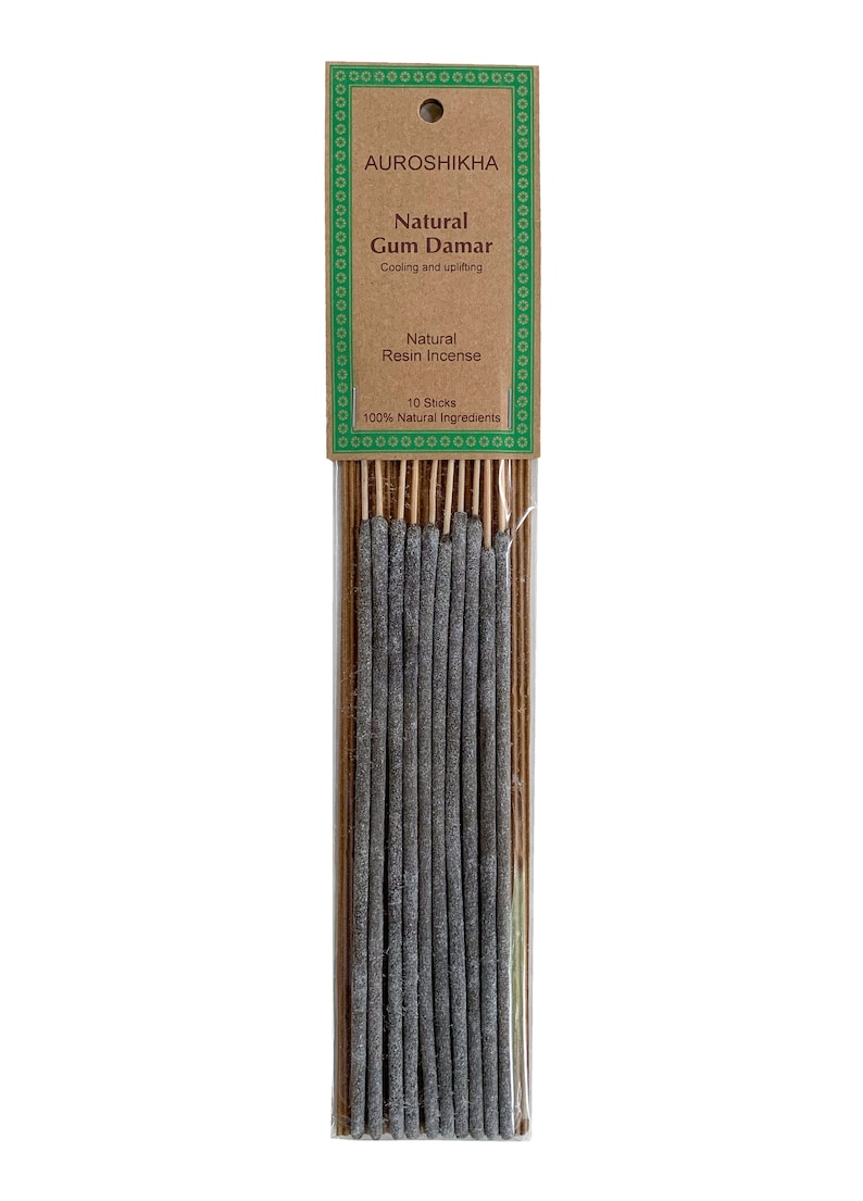 May include: A pack of 10 natural Gum Damar resin incense sticks. The packaging is brown with green borders and text that reads "AUROSHIKHA Natural Gum Damar Cooling and uplifting Natural Resin Incense 10 Sticks 100% Natural Ingredients".