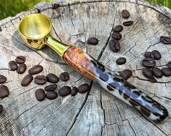 Handmade coffee scoop made with burl wood and real coffee beans cast in resin. Gold colored scoop.