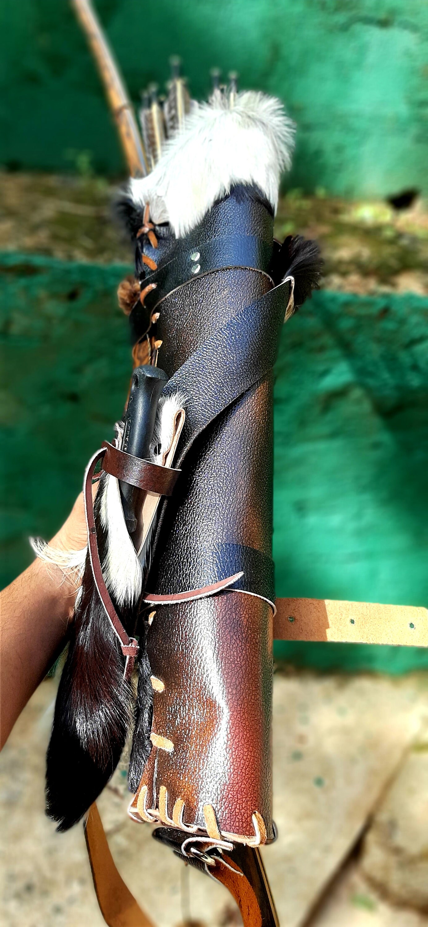 Arrow quiver with fur top and fur knife sheath attached to the Etsy