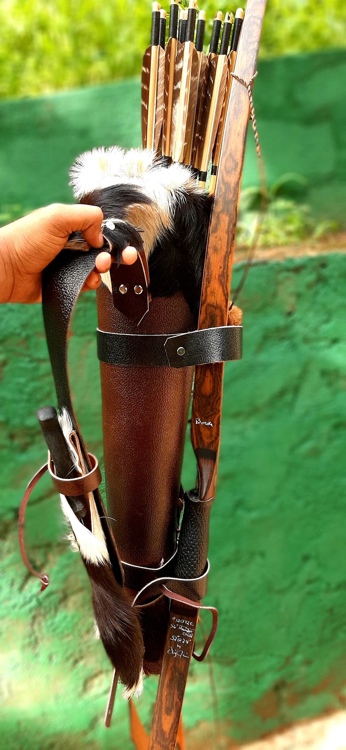 Arrow quiver with fur top and fur knife sheath attached to the Etsy