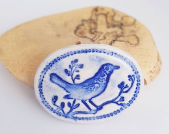 Blue Bird Ceramic Brooch: Handmade Embossed Bird Badge.