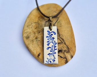 Handmade Ceramic Bird Pendant Necklace: Embossed Blue Design
