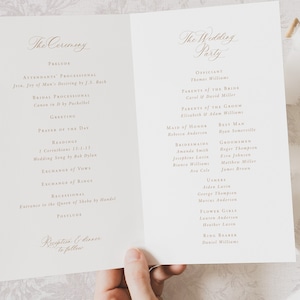May include: A wedding ceremony program with a white background and gold text. The program lists the order of events for the ceremony, including the processional, readings, exchange of vows, and recessional. It also includes the names of the officiant, wedding party, and parents of the bride and groom.