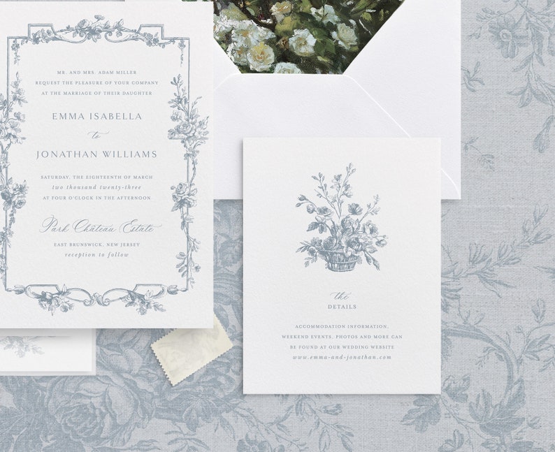 May include: A wedding invitation with a floral border and a basket of flowers. The invitation is for Emma Isabella and Jonathan Williams, and it is set for Saturday, March 18th, 2023 at 4:00 PM at Part Chateau Estate in East Brunswick, New Jersey. The invitation also includes a separate card with details about the wedding, including accommodation information, weekend events, photos, and more.